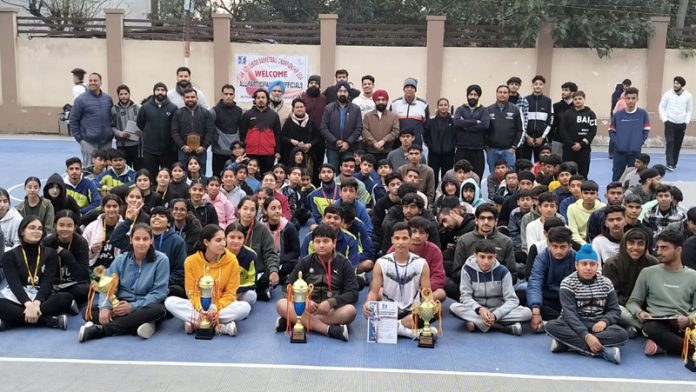 Basketball players posing with dignitaries at Mini Stadium Parade, Jammu on tuesday. Basketball players posing with dignitaries at Mini Stadium Parade, Jammu on tuesday.