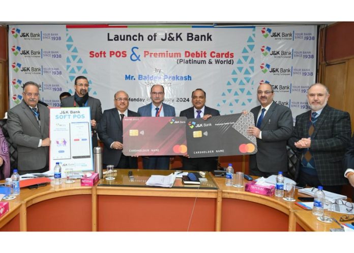 MD and CEO of J&K Bank, Baldev Prakash along with senior executives launching the Bank's Soft POS and Premium Debit Cards. MD and CEO of J&K Bank, Baldev Prakash along with senior executives launching the Bank's Soft POS and Premium Debit Cards.