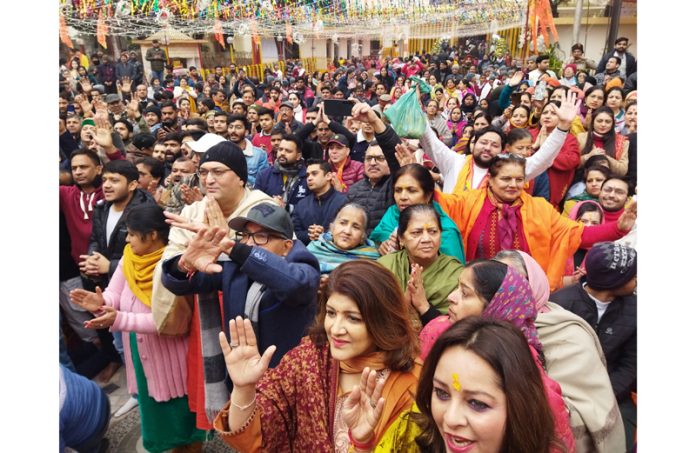 Devotees dancing and chanting Ram Bhajans during a grand function held at Shri Raghunath Ji Temple in Jammu on Monday. -Excelsior/Rakesh