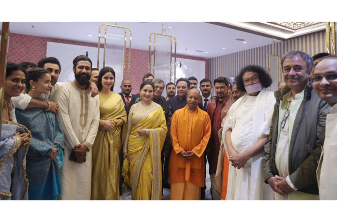 UP CM Yogi Adityanath along with film stars and others at Ayodhya on Monday. -Excelsior/Photo