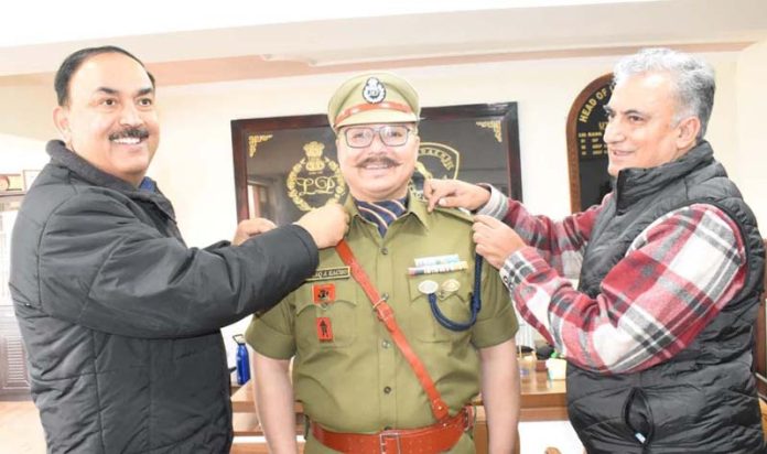 ADGP Ladakh S D Singh Jamwal and DIG Sheikh Junaid Mehmood pinning rank of Incharge SP Ishtyaq Ahmad Kacho on Wednesday.