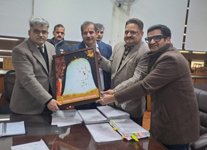 Members of TFJ delegation presenting a photograph of the Ice-Shivalingam of Baba Amarnathji to Chief Secretary, Atal Dulloo.