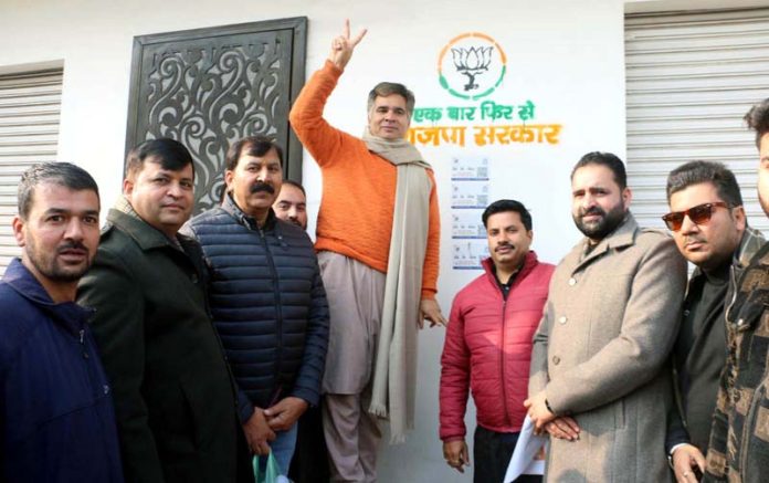 BJP JK UT, president, Ravinder Raina during party's wall writing campaign at Jammu on Monday.