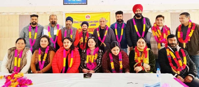 NHM employees pose for a group photograph during a convention at Jammu.