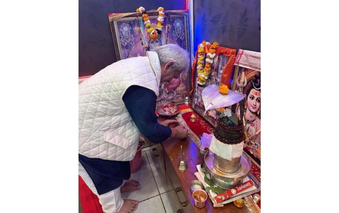 LG Manoj Sinha lighting lamp in his house on Monday. LG Manoj Sinha lighting lamp in his house on Monday.