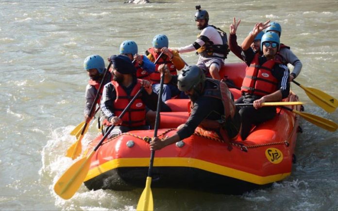 Deputy Commissioner, Doda Harvinder Singh doing rafting in Chenab on Sunday. -Excelsior/Tilak