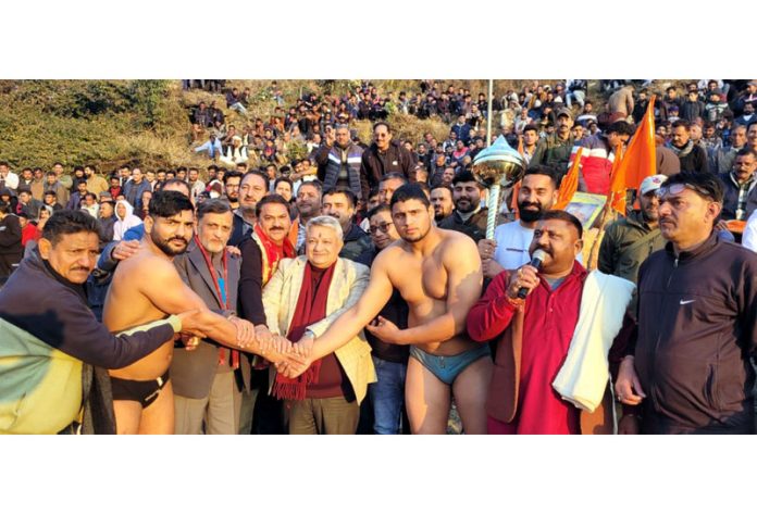 Deputy Commissioner Reasi, Vishesh Paul Mahajan introducing wrestlers before bout at Reasi on Monday.