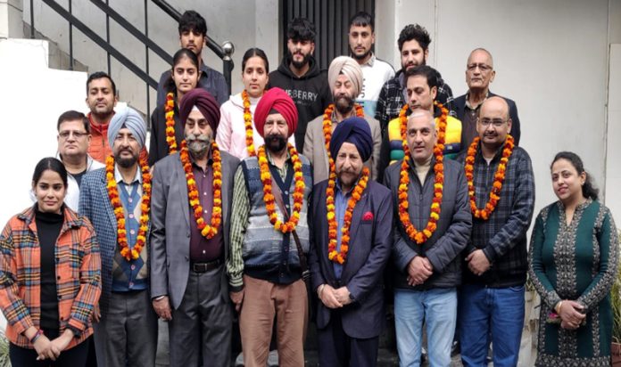 Newly elected members of District Mountaineering Association, Rajouri posing for a group photograph.