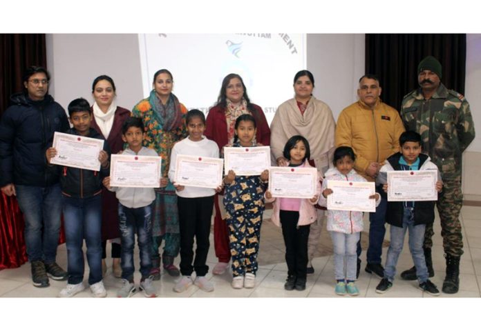 Students of Renmei Goju-Ryu Karate-Do posing with certificates at Nagrota on Monday.