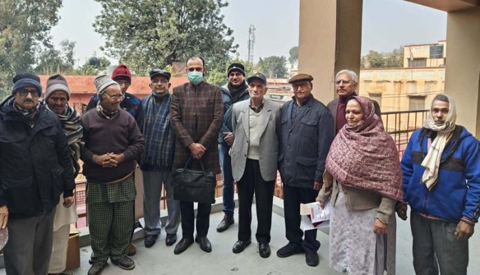 HoD Cardiology GMC Jammu Dr Sushil Sharma with patients at Home for Aged & Infirm, Ambphalla on Sunday.