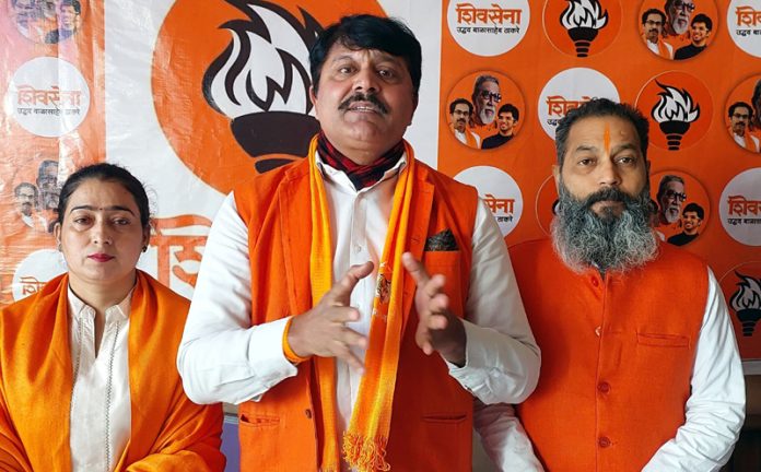  Shiv Sena president Manish Sahni posing along with party workers.