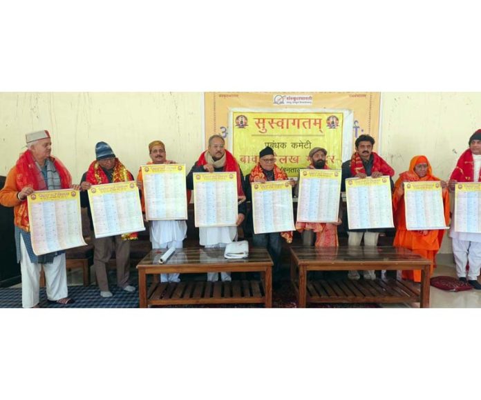 VHP working president Rajesh Gupta and others during release of 'Laghu Panchang' at Bawa Kailakh Dev Temple, Thathar (Bantalab), Jammu.