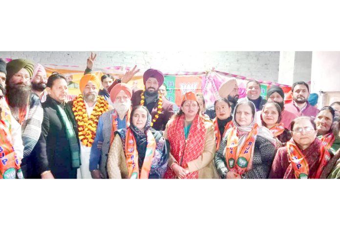 Senior BJP leaders along with new entrants of the party in a function held at Digiana Camp, Jammu.