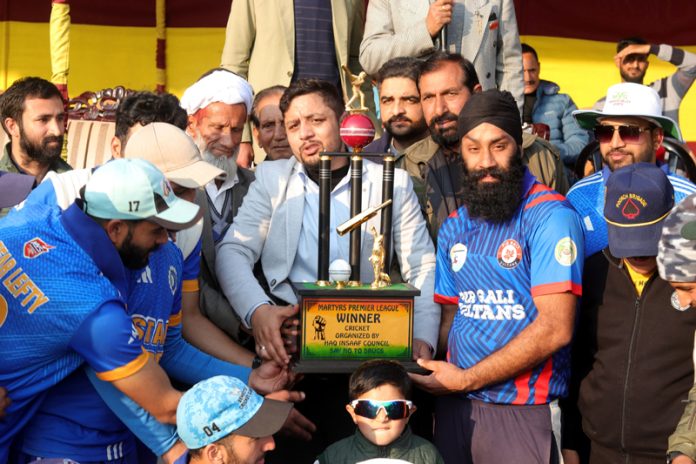 Winning team posing with trophy during Martyrs Premier League at Poonch. Winning team posing with trophy during Martyrs Premier League at Poonch.