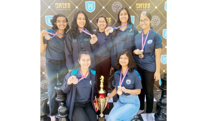 Arushi Kotwal along with other winners displaying medals during a Chess Championship.