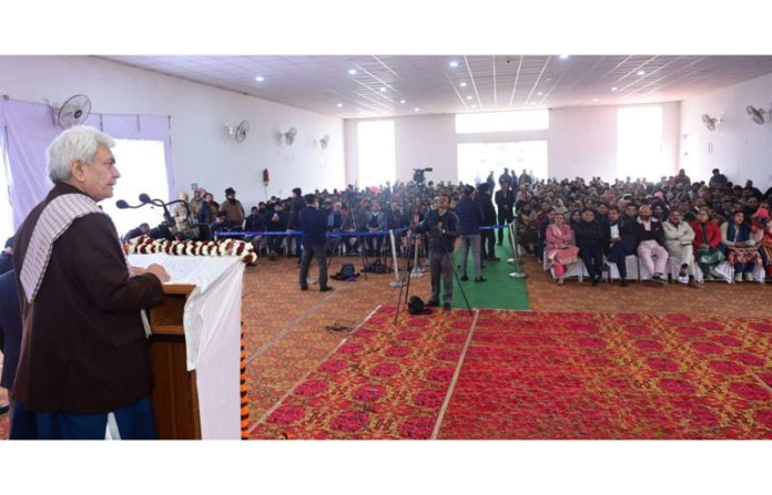 LG Manoj Sinha addressing a gathering during Block Diwas at Bhalwal on Wednesday.