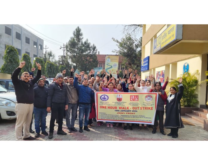 LIC employees raise slogans during a protest demonstration at Jammu on Wednesday. LIC employees raise slogans during a protest demonstration at Jammu on Wednesday.