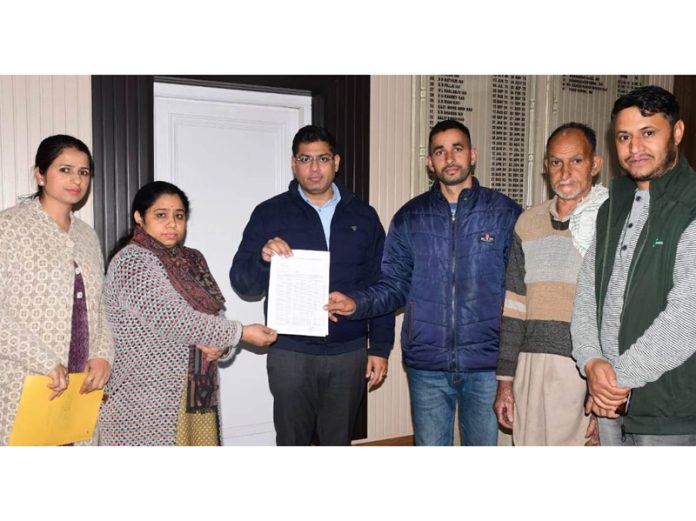 DC Vikas Kundal releasing educational assistance on Tuesday.