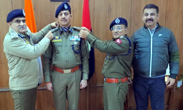 ADGP Jammu Zone, Anand Jain, decorating with rank SSP Surinder Choudhary in Jammu on Tuesday. ADGP Jammu Zone, Anand Jain, decorating with rank SSP Surinder Choudhary in Jammu on Tuesday.