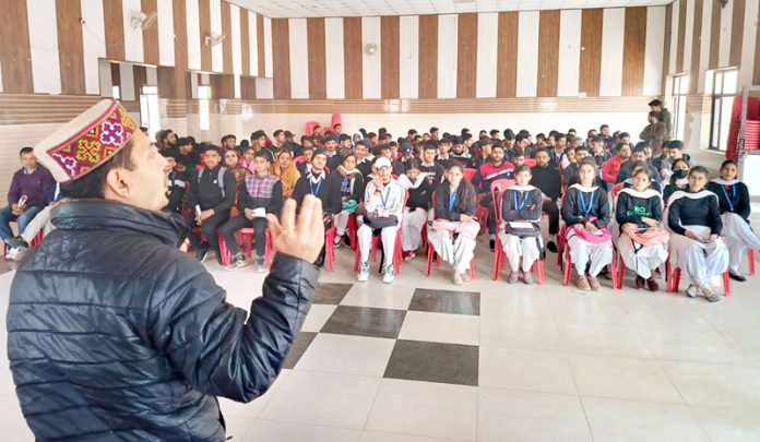 Ex-MLA R S Pathania addressing a gathering.