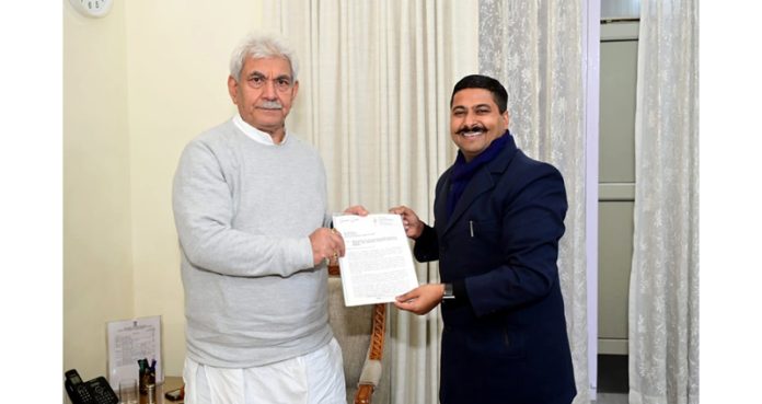 Former general secretary of CCI Jammu Gaurav Gupta presenting a memorandum to LG Manoj Sinha.