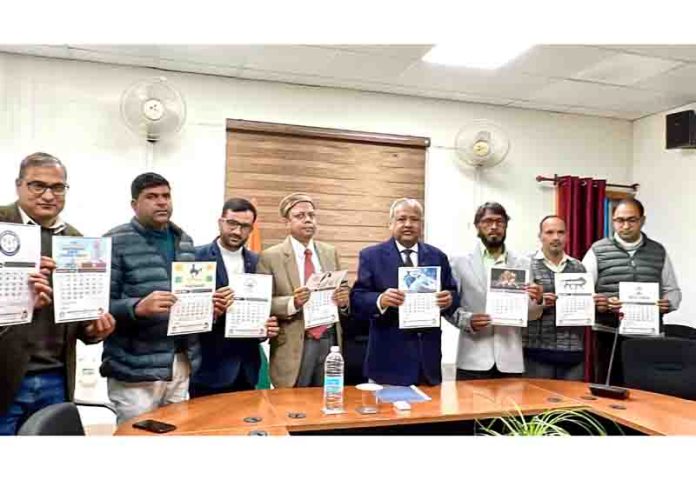 Vice-Chancellor Prof Akbar Masood and others unveiling wall calendar 2024 of BGSBU.