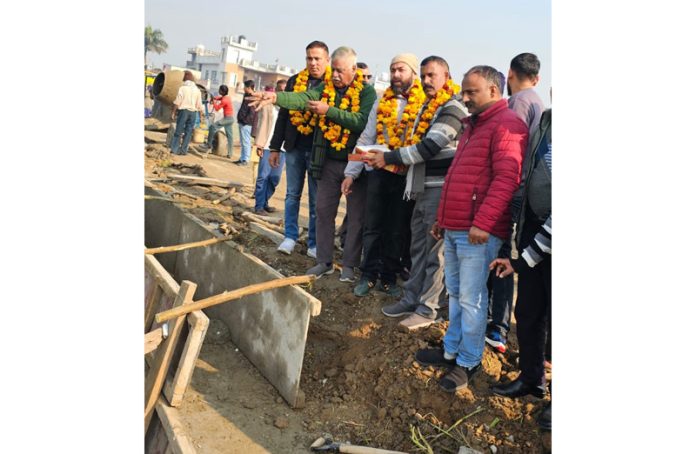 Former Minister, Ch Sukhnandan kick starting development works in Pounichak on Thursday. Former Minister, Ch Sukhnandan kick starting development works in Pounichak on Thursday.