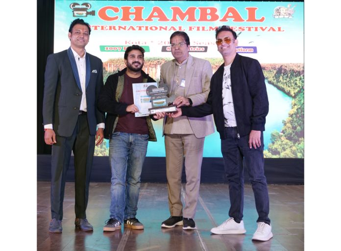 Indu Shekhar receives award for his short film at an International Film Festival.