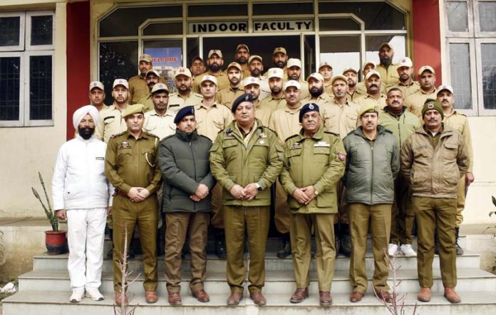 Dushyant Sharma, SSP, Incharge Principal PTTI Vijaypur posing with officers and trainees.