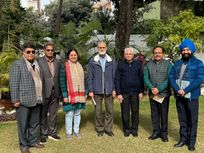 Members of Sarvodaya International Trust pose for a group photograph after a meeting in Jammu on Monday.