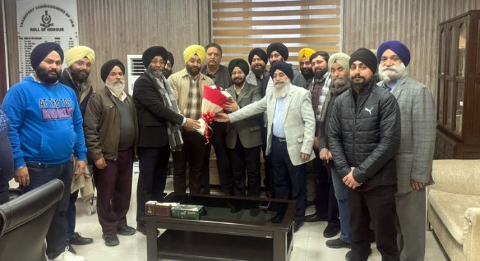 Transporters’ delegation meeting with Transport Commissioner R S Tara at Jammu on Tuesday. -Excelsior/Tilak Raj