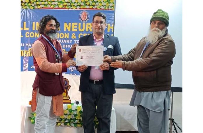 A neurotherapist receiving certificate during 24th Neurotherapy Annual Convention on Thursday.