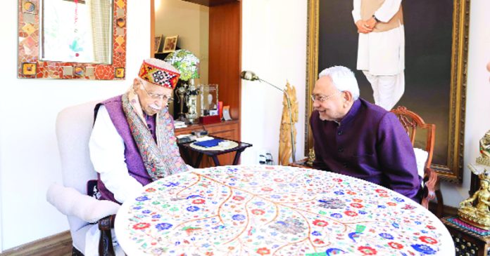 Bihar Chief Minister Nitish Kumar call on former Deputy Prime Minister and veteran BJP leader L K Advani at his residence Prithviraj Road, in New Delhi on Thursday. (UNI)