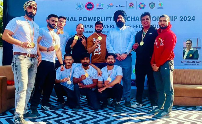 Powerlifters posing for group photograph.
