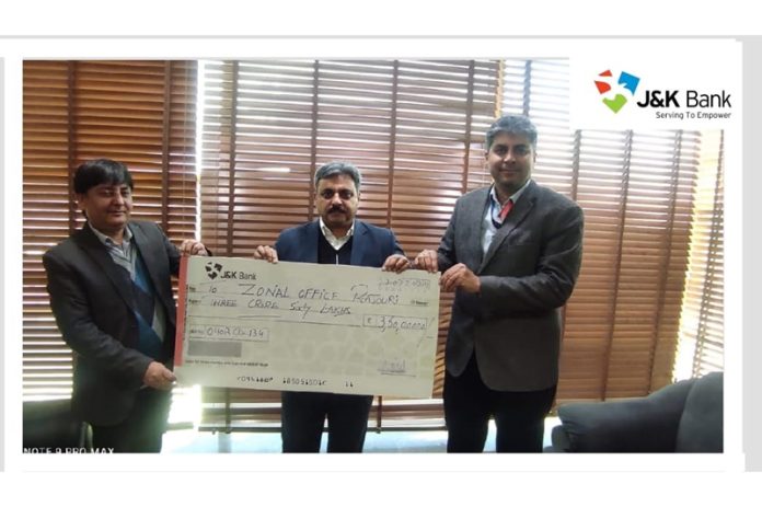 JK Bank officer handing over cheque to a legal heir.