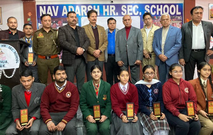 Dignitaries posing along with students during a programme at Kathua on Tuesday. Dignitaries posing along with students during a programme at Kathua on Tuesday.