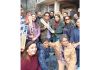 God of cricket Sachin Tendulkar alongwith family displaying bats while posing for a group photograph at Chersoo Awantipora in Pulwama district on Saturday. -Excelsior/Sajad Dar