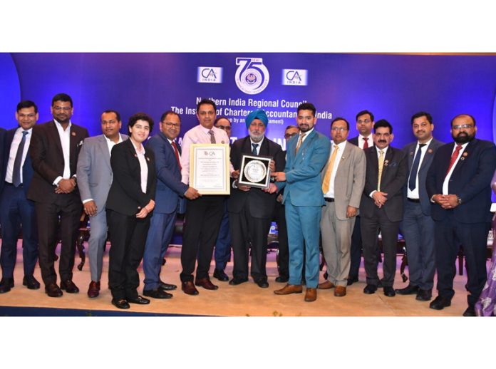 Vineet Kohli, Chairman, J&K Branch of ICAI receiving award from Charanjot Singh Nanda, Vice-President of ICAI in a function held on Monday.