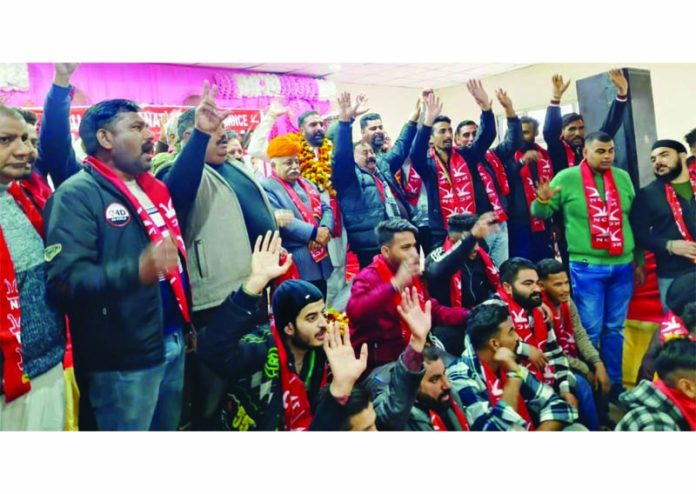 Senior NC leader Ajay Kumar Sadhotra with new entrants of the party at Udheywalla in Jammu North Assembly Constituency.