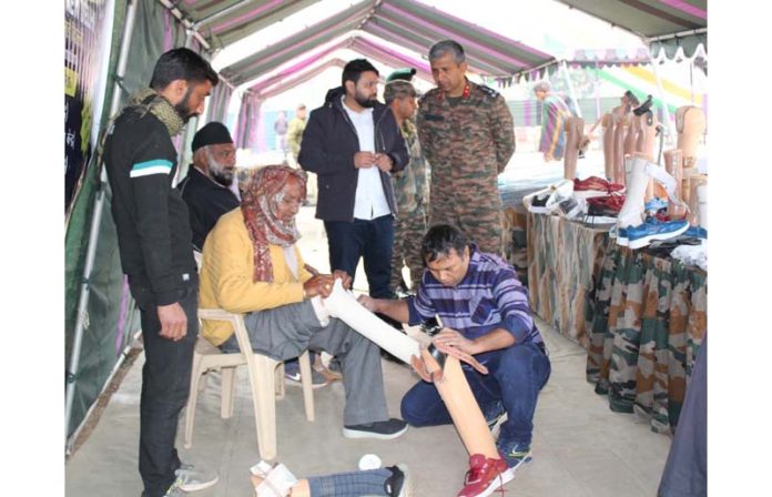 A man being given artificial leg at a camp organised by Army in Nowshera area on Saturday.