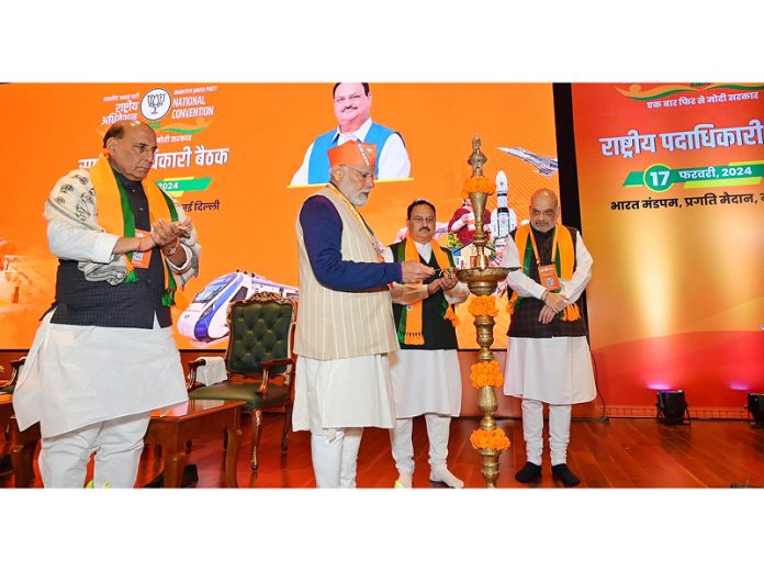 Prime Minister Narendra Modi lights lamp as BJP president J P Nadda, Defence Minister Rajnath Singh and Union Home Minister Amit Shah look on at the BJP National Council meeting at Bharat Mandapam, in New Delhi on Saturday.(UNI) Prime Minister Narendra Modi lights lamp as BJP president J P Nadda, Defence Minister Rajnath Singh and Union Home Minister Amit Shah look on at the BJP National Council meeting at Bharat Mandapam, in New Delhi on Saturday.(UNI)