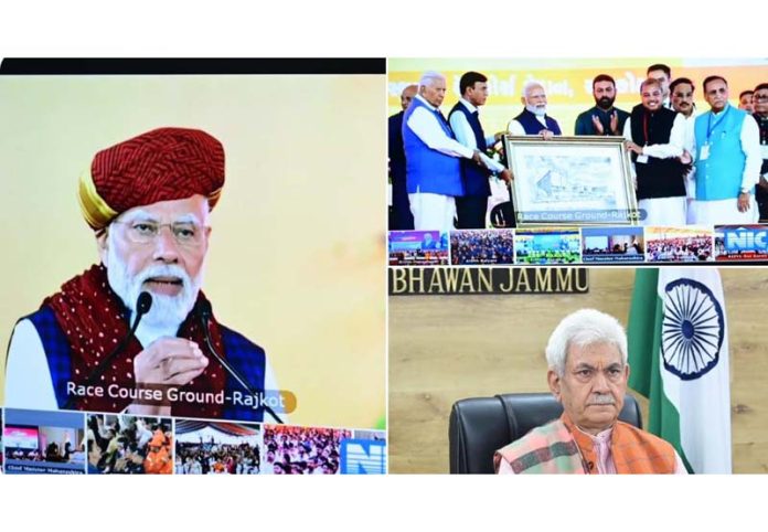 PM Narendra Modi laying foundation stone and inaugurating projects at Rajkot. LG Manoj Sinha joins the function virtually from Jammu.