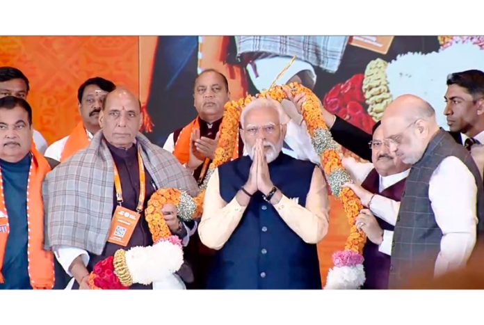 Prime Minister Narendra Modi being garlanded by Union Home Minister Amit Shah, Defence Minister Rajnath Singh, BJP National President JP Nadda and others during the BJP National Council Meeting in New Delhi on Sunday.(UNI ) Prime Minister Narendra Modi being garlanded by Union Home Minister Amit Shah, Defence Minister Rajnath Singh, BJP National President JP Nadda and others during the BJP National Council Meeting in New Delhi on Sunday.(UNI )