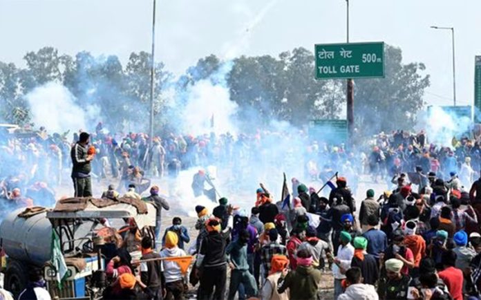 Haryana Police fires teargas shells to stop protesters at Shambhu border of Punjab and Haryana near Ambala on Wednesday.