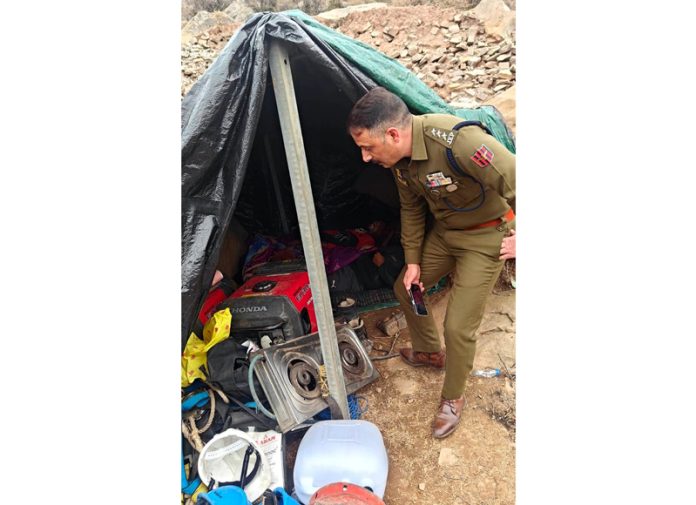 DySP Tahir examining spot after mysterious death of three workers in Chenani area. -Excelsior/K Kumar