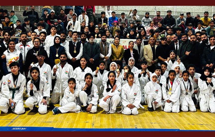 Athletes displaying medals along with dignitaries at Jammu on Sunday.