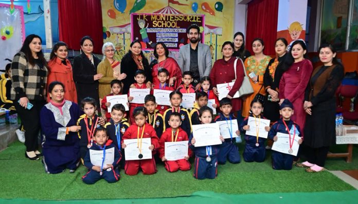 Students posing along with certificates.