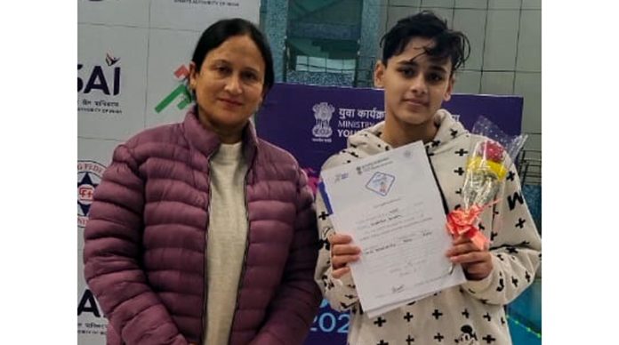 Swimmer Vanshika Gusain poses for a photograph with her Coach, Babita. Swimmer Vanshika Gusain poses for a photograph with her Coach, Babita.