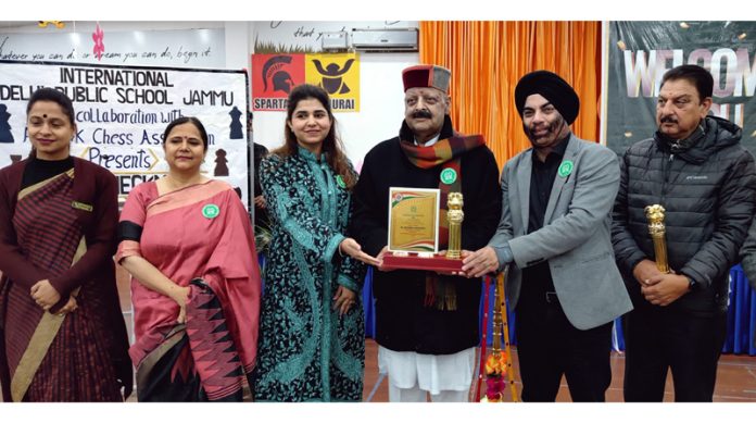 Senior BJP leader Devender Singh Rana receiving memento from management of IDPS on Friday.