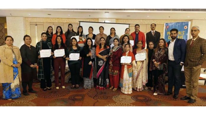 Dignitaries pose for a group photograph during a conclave organized by Shri Ram Universal School in Jammu.